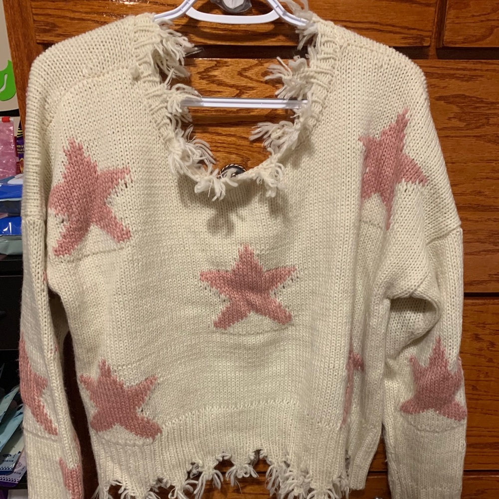 star over shoulder sweater